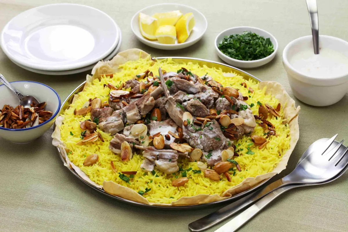 Plate of Middle Eastern Lamb Dish, Mansaf with Almond Halves - Global Favorites